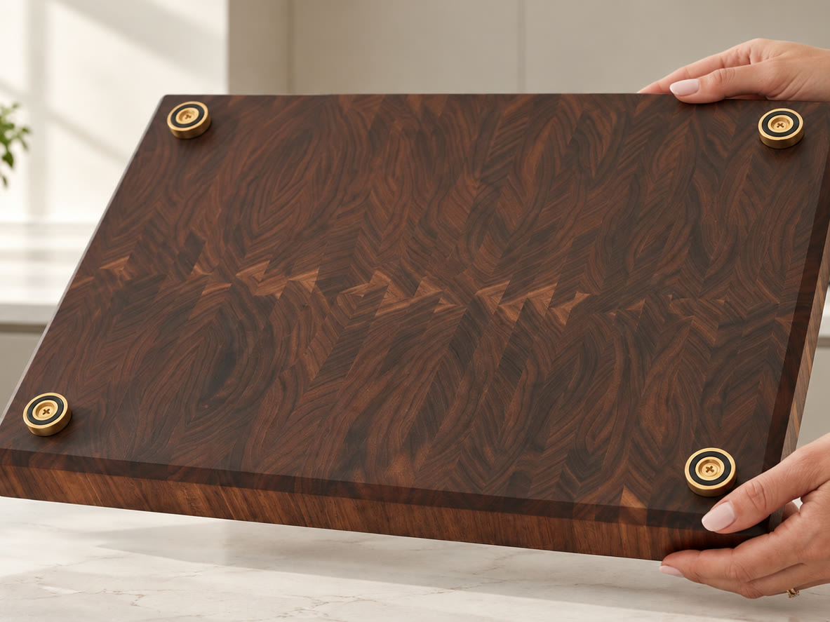 Hands lifting the board to show its underside and four feet