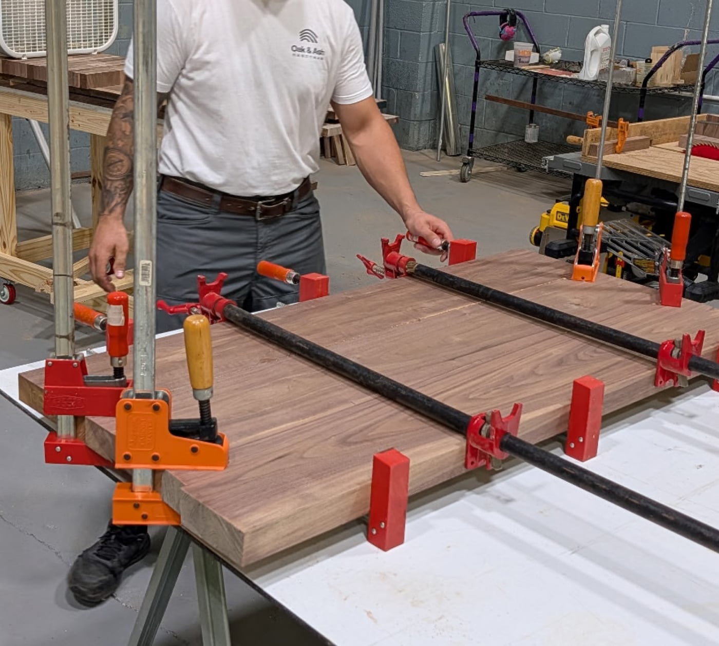 Gluing up a solid walnut top in our shop